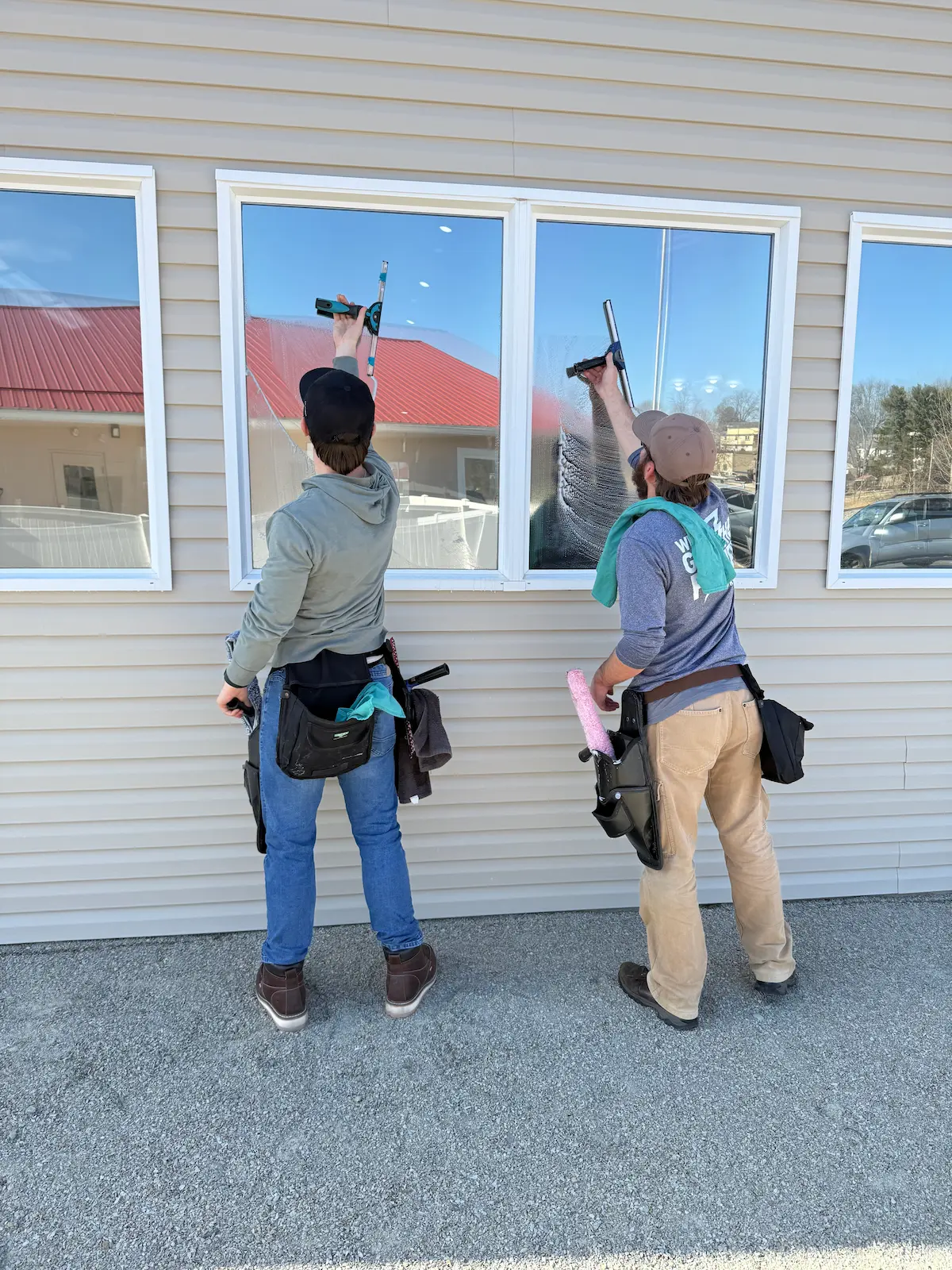 Two Power Clean technicians cleaning the windows at the Columbus Zoo and Aquarium