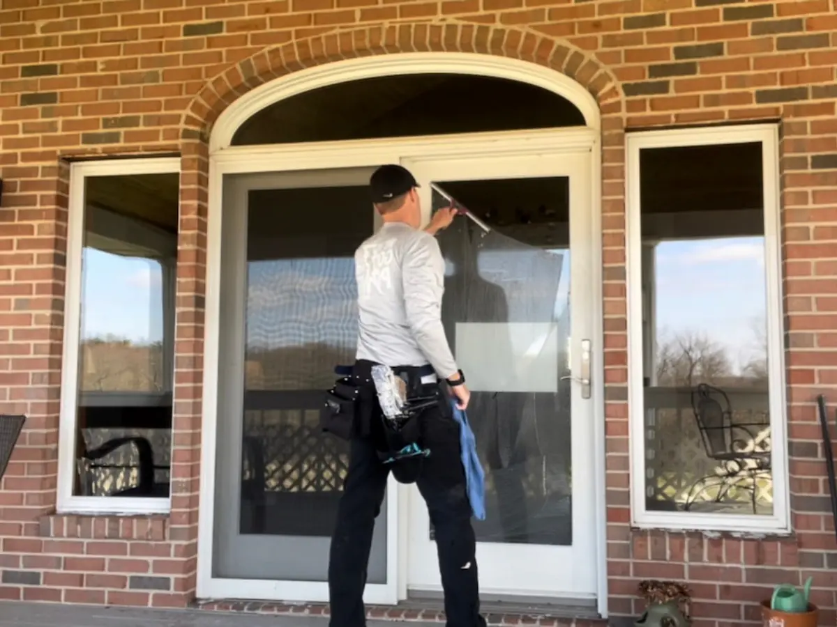 Copy of Untitled Owner of Power Clean cleaning windows at a home in Central Ohio
