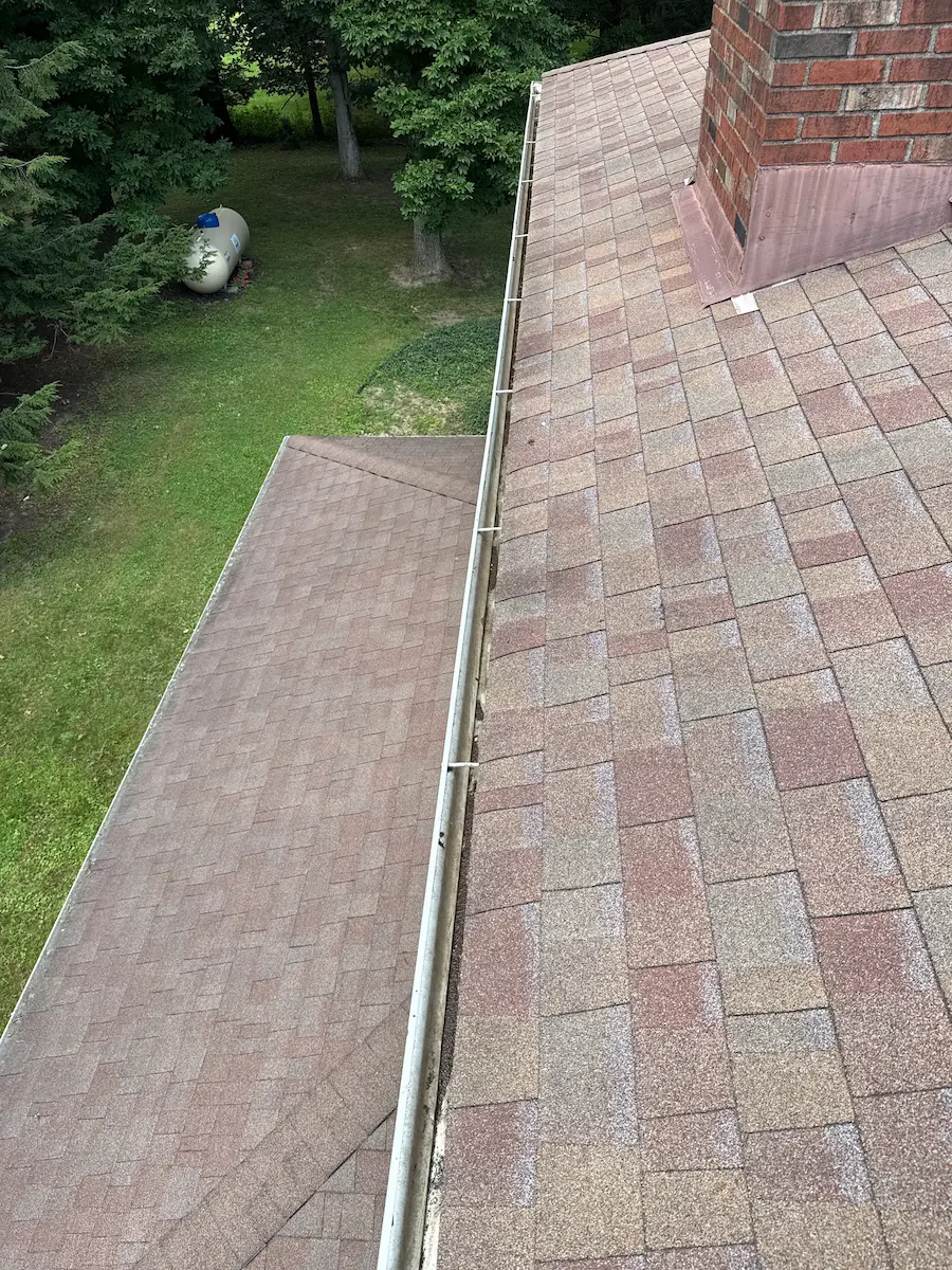 Gutter Cleaning After 2 Gutters cleaned of debris and leaves by power clean technician