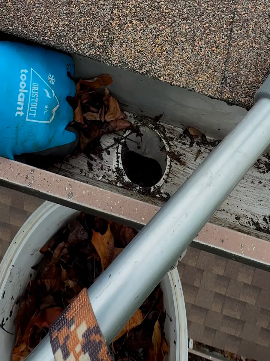 Gutter Cleaning Process 2 Close up of Gutters being cleaned of leaves by power clean technician