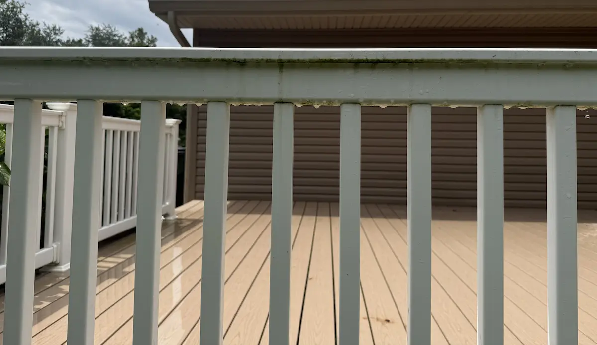 Railing before being pressure washed by power clean