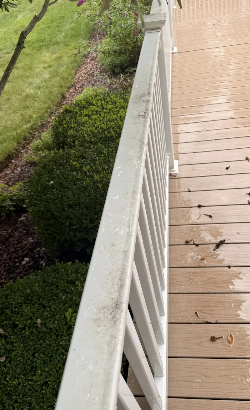 Railing before being pressure washed by power clean