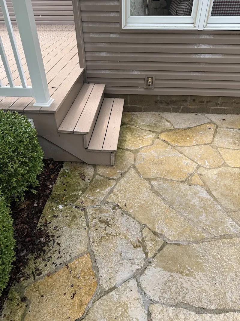Stone walkway before being pressure washed by power clean
