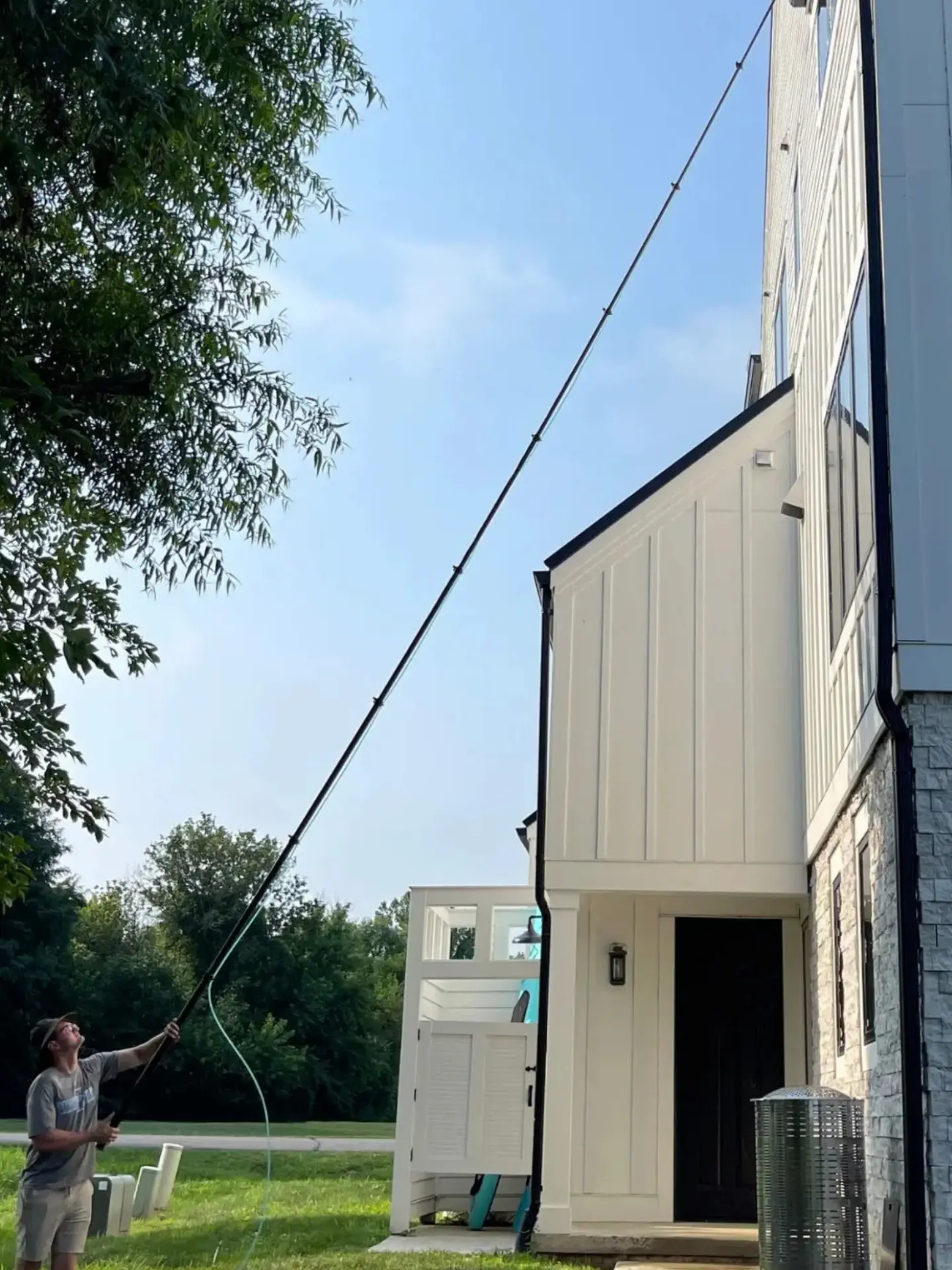 Power Clean cleaning high windows with a water fed pole at Buckeye Lake, OH