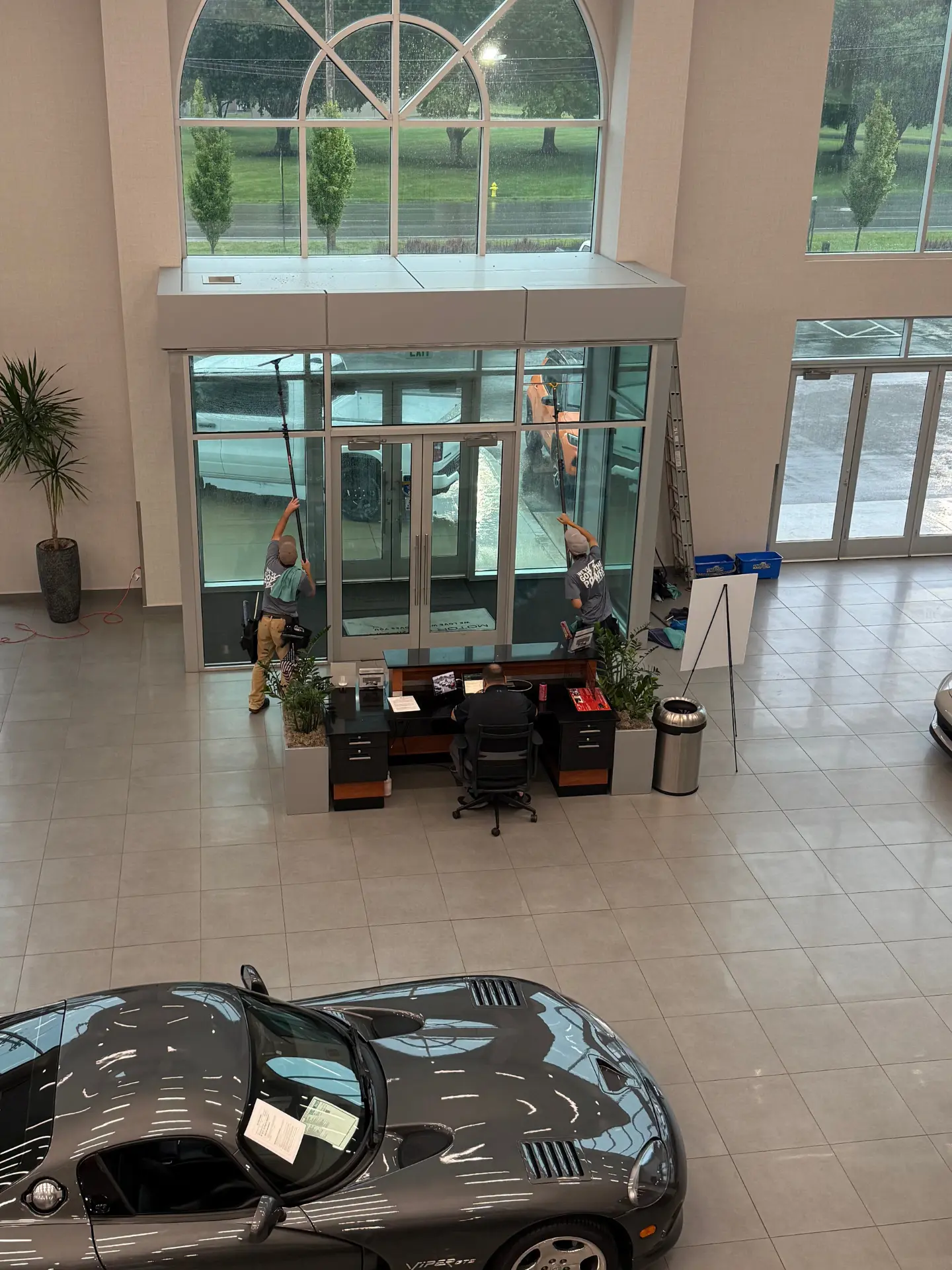 John-Hinderer-dealership-dodge-window-cleaning concrete back patio in heron bay thornville before being pressure washed