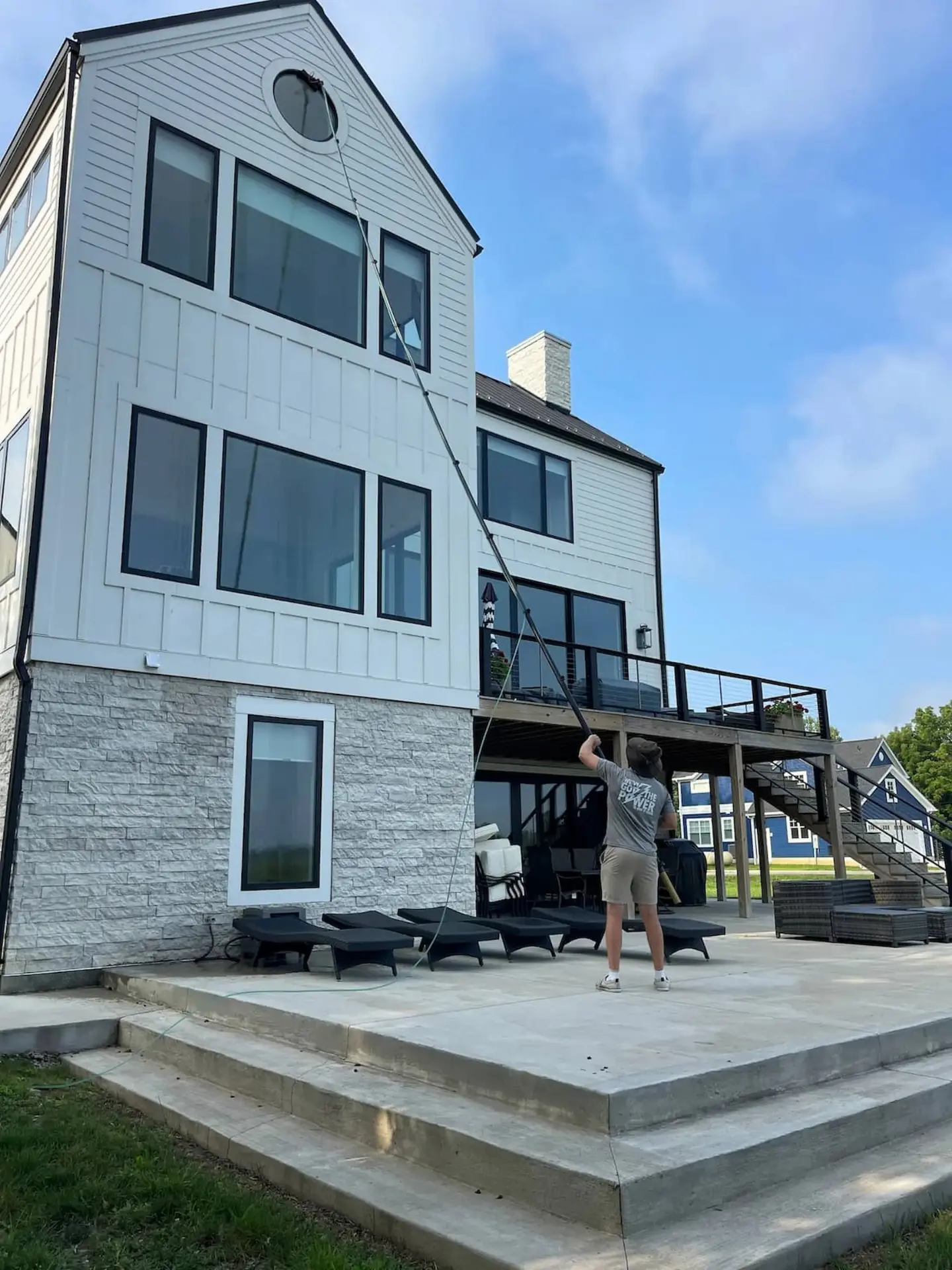 Third story window cleaning with water fed pole by Power Clean at Buckeye Lake, OH