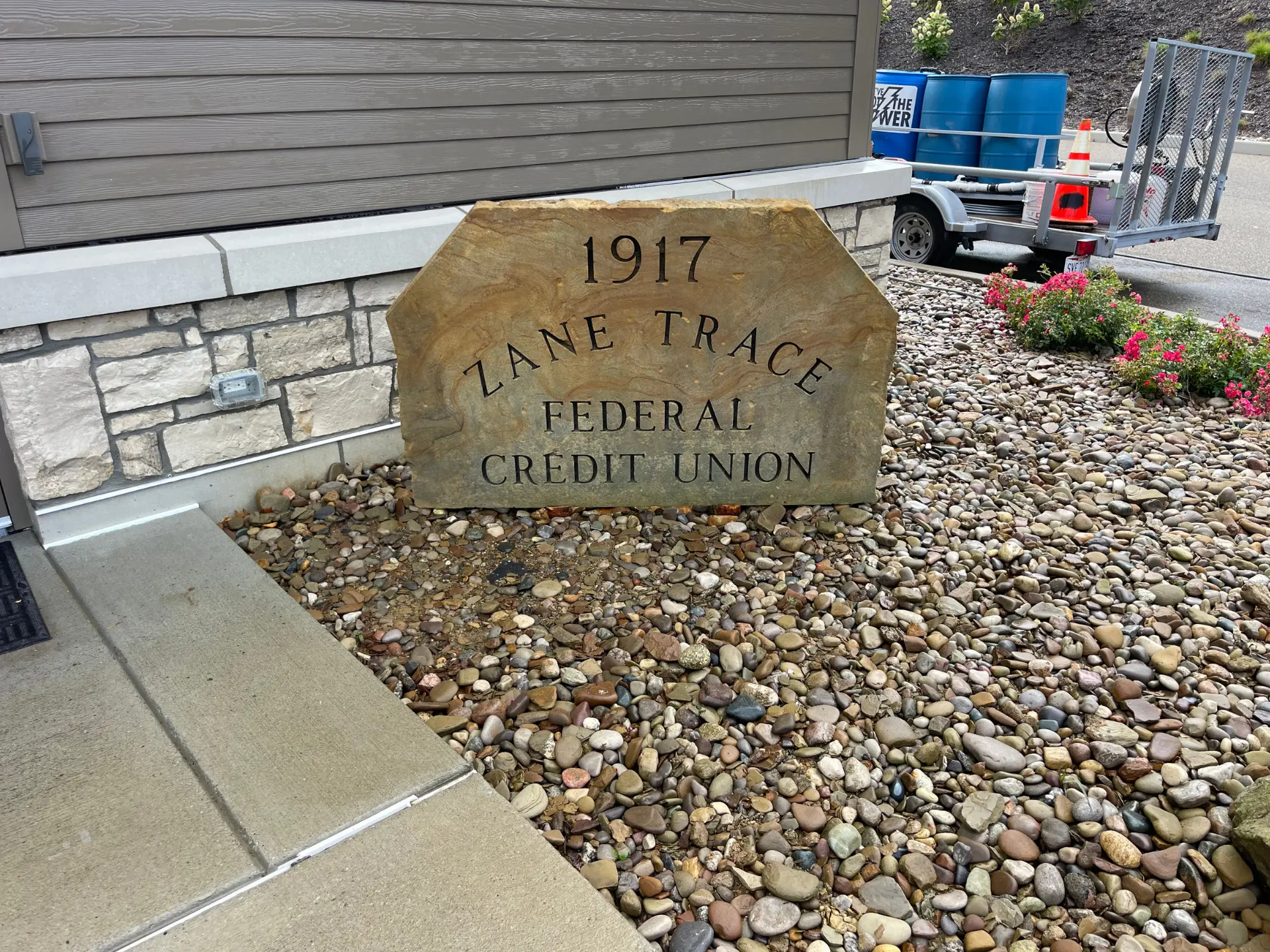 Zane trace concrete sign after being pressure washed by power clean