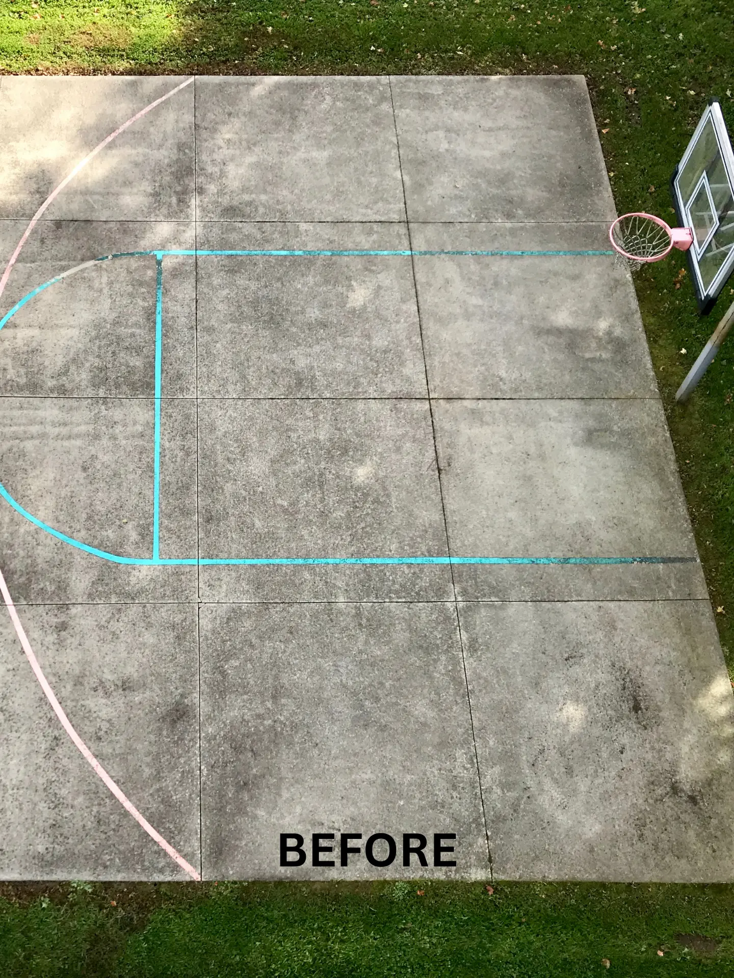 basketball-court-cleaning-before aerial view of a dirty basketball court before being pressure washed