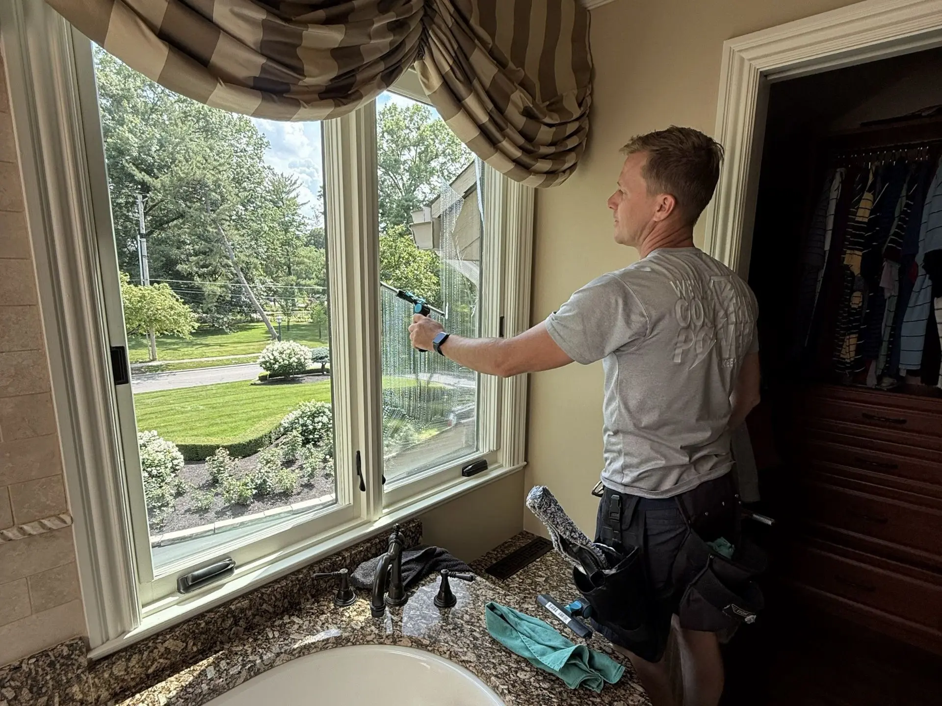 expert-window-cleaning.webp Power Clean technician cleaning the interior windows of a house in central oh