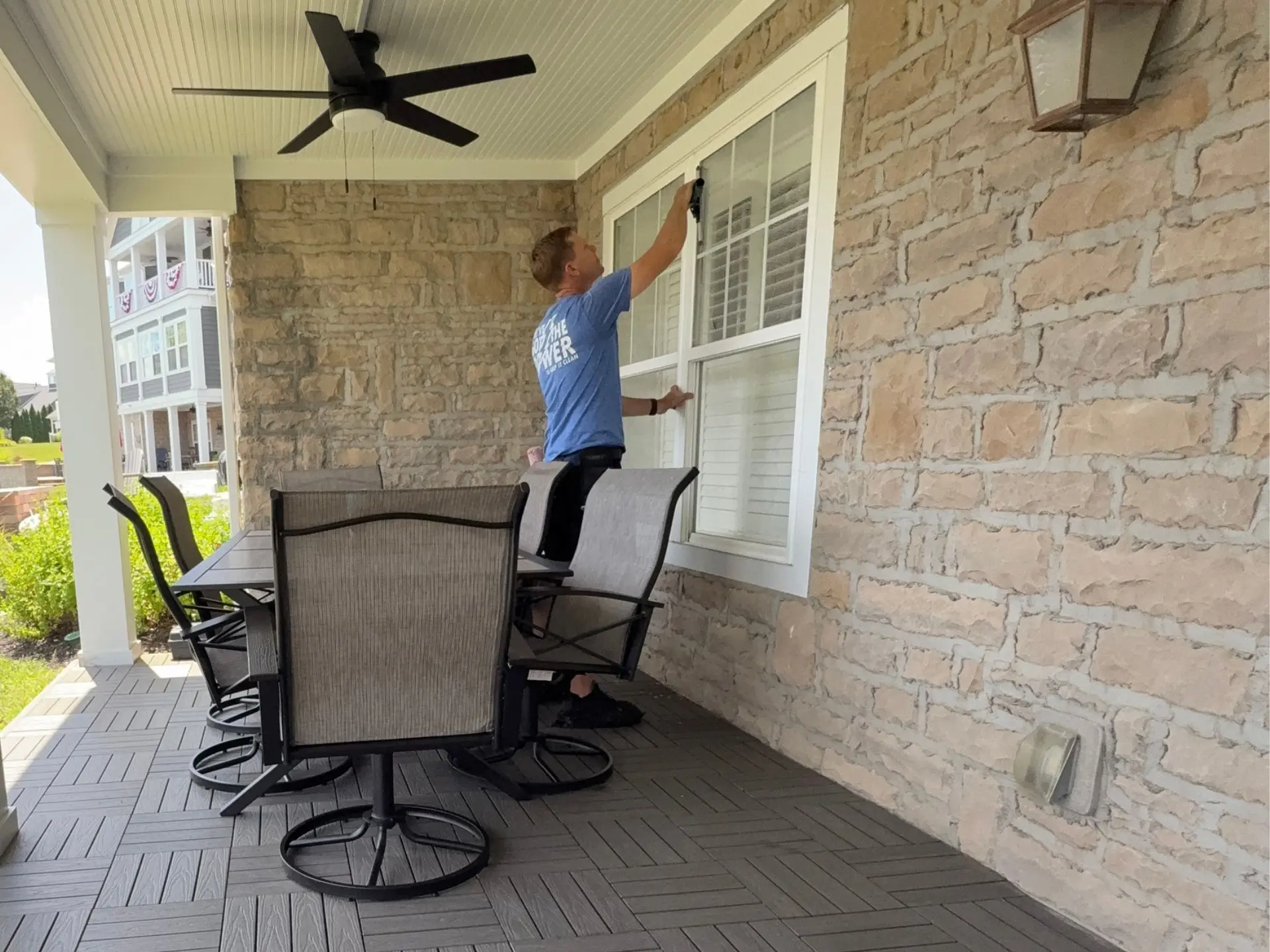 home-window-cleaning.webp Power clean technician cleaning the entry exterior windows of a home in central oh