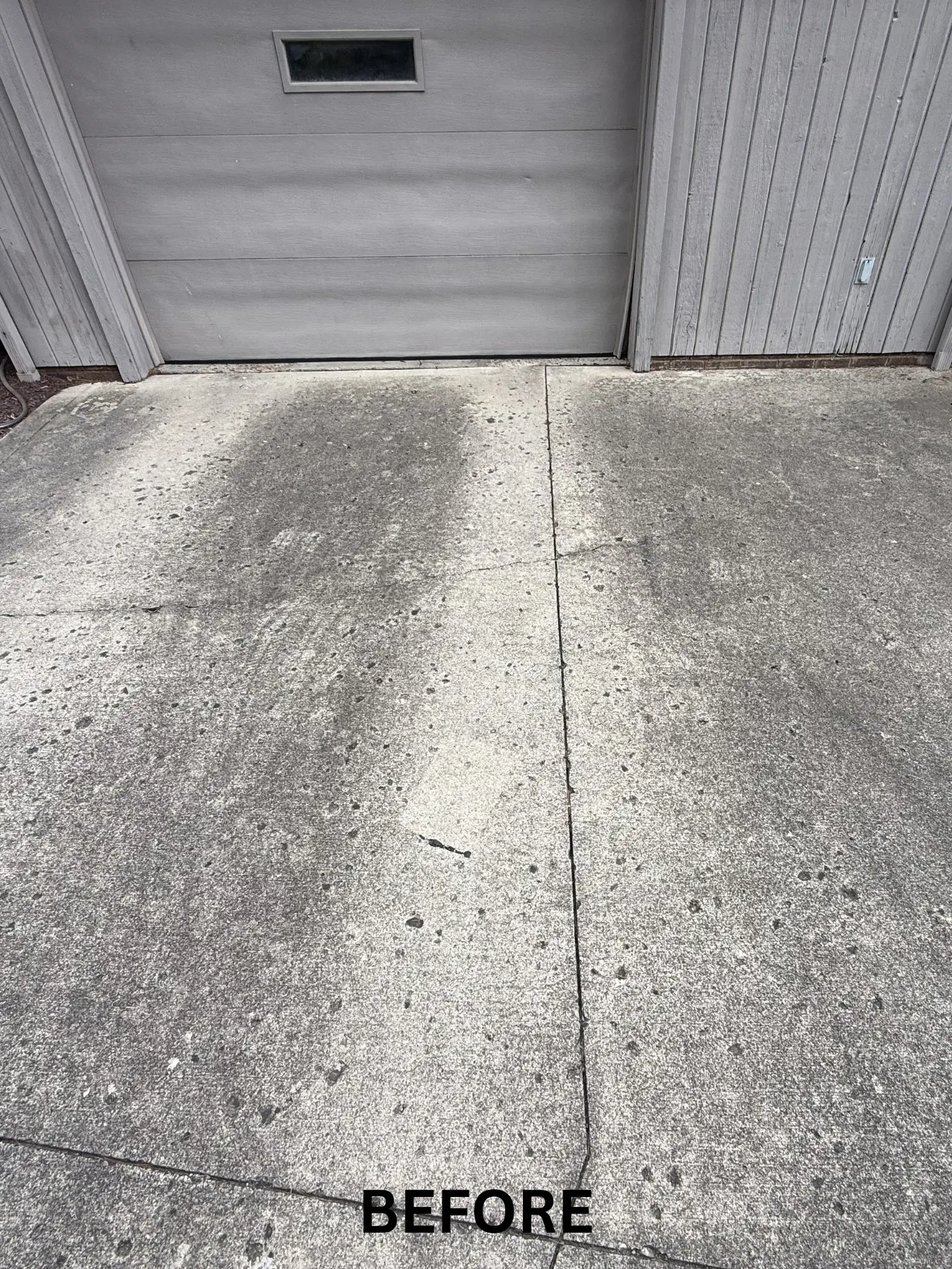 concrete driveway before being pressure washed by power clean