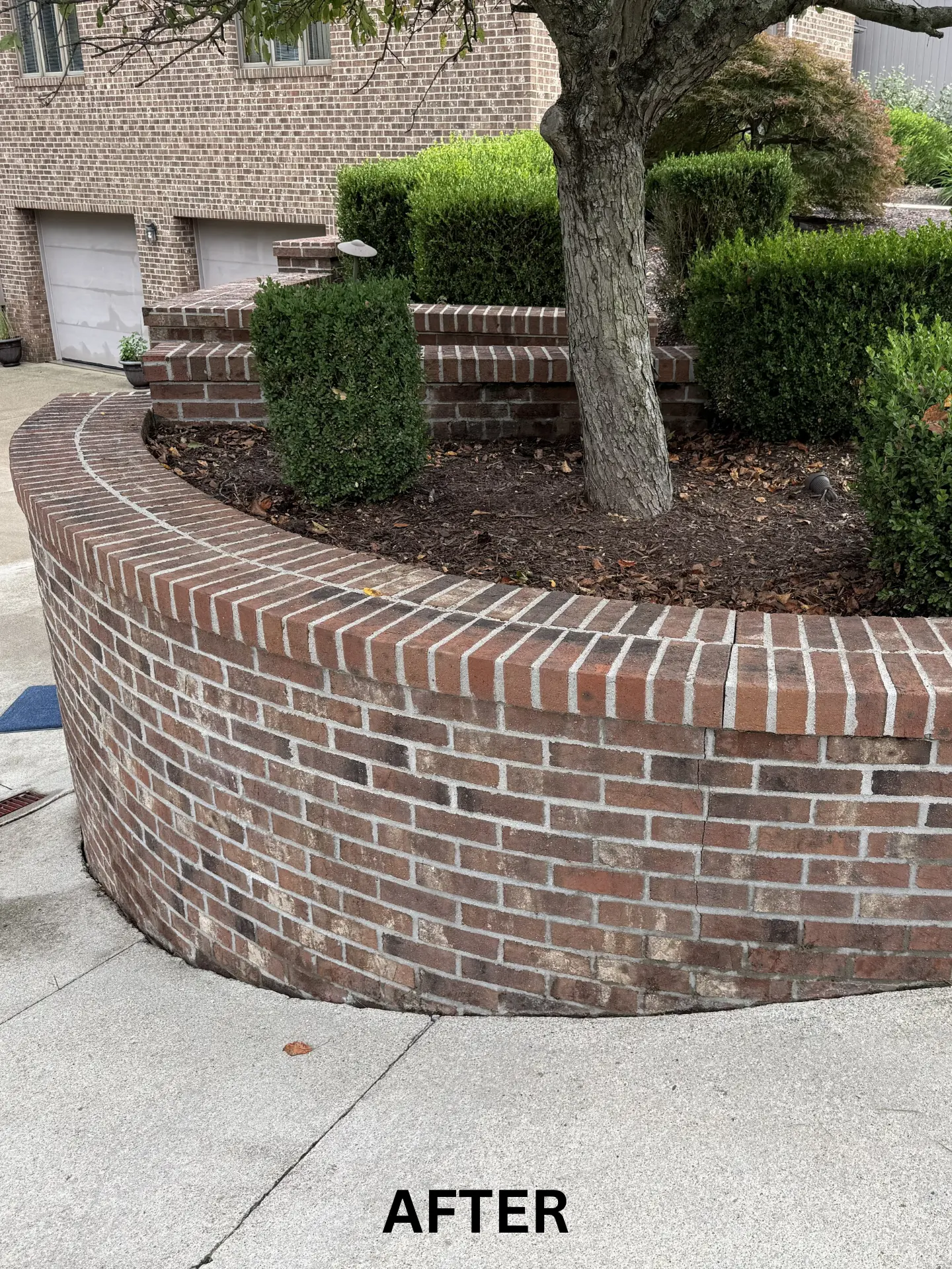 brick retaining wall after being pressure washed by power clean
