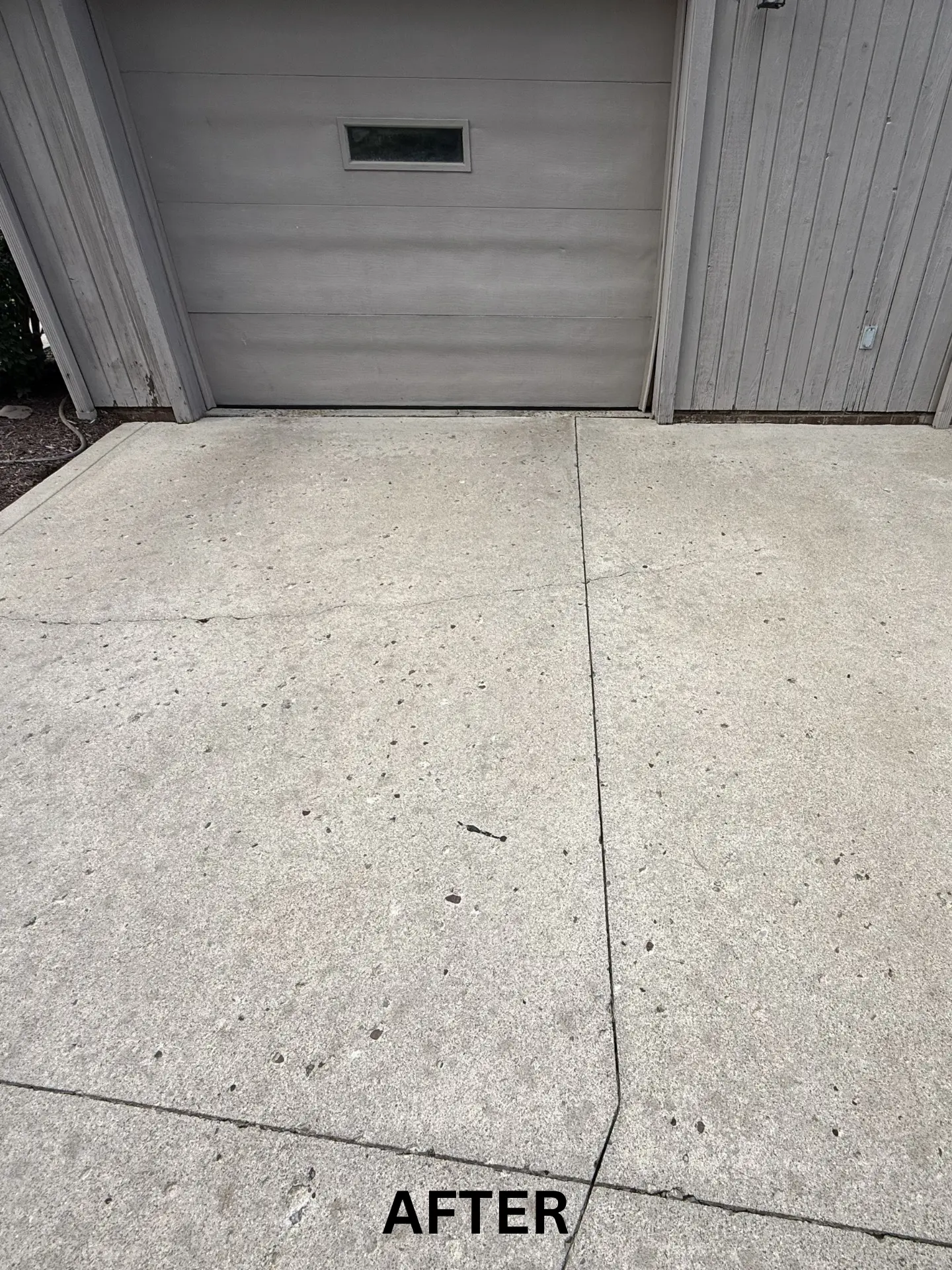 concrete driveway after being pressure washed by power clean