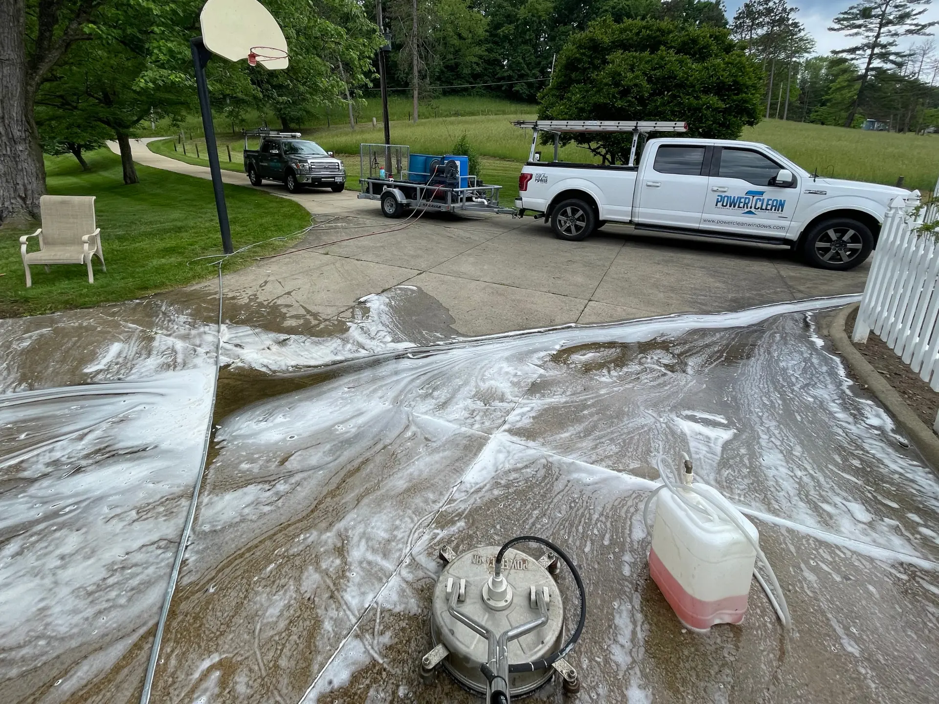 Power Clean pressure washing a concrete driveway at a home in zanesvillle OH