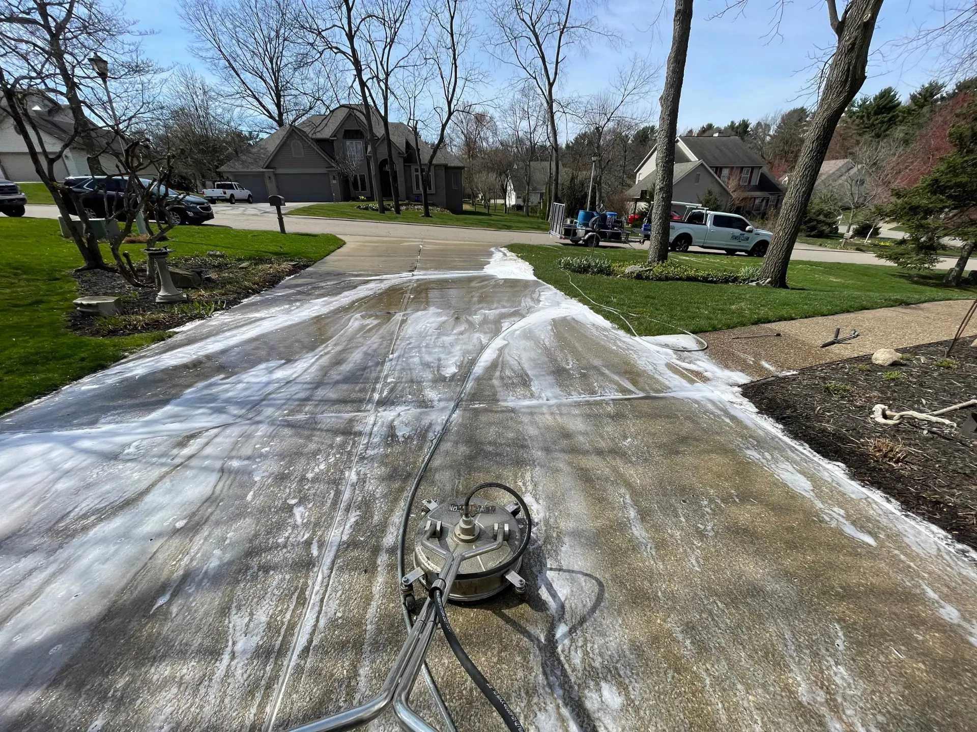 Power Clean using a surface cleaner to pressure wash a concrete driveway at a home in newark OH