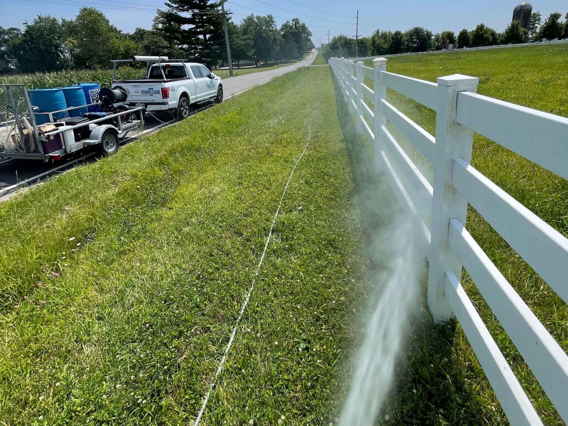 Power Clean pressure washing a white fence line at a home in Lancaster OH