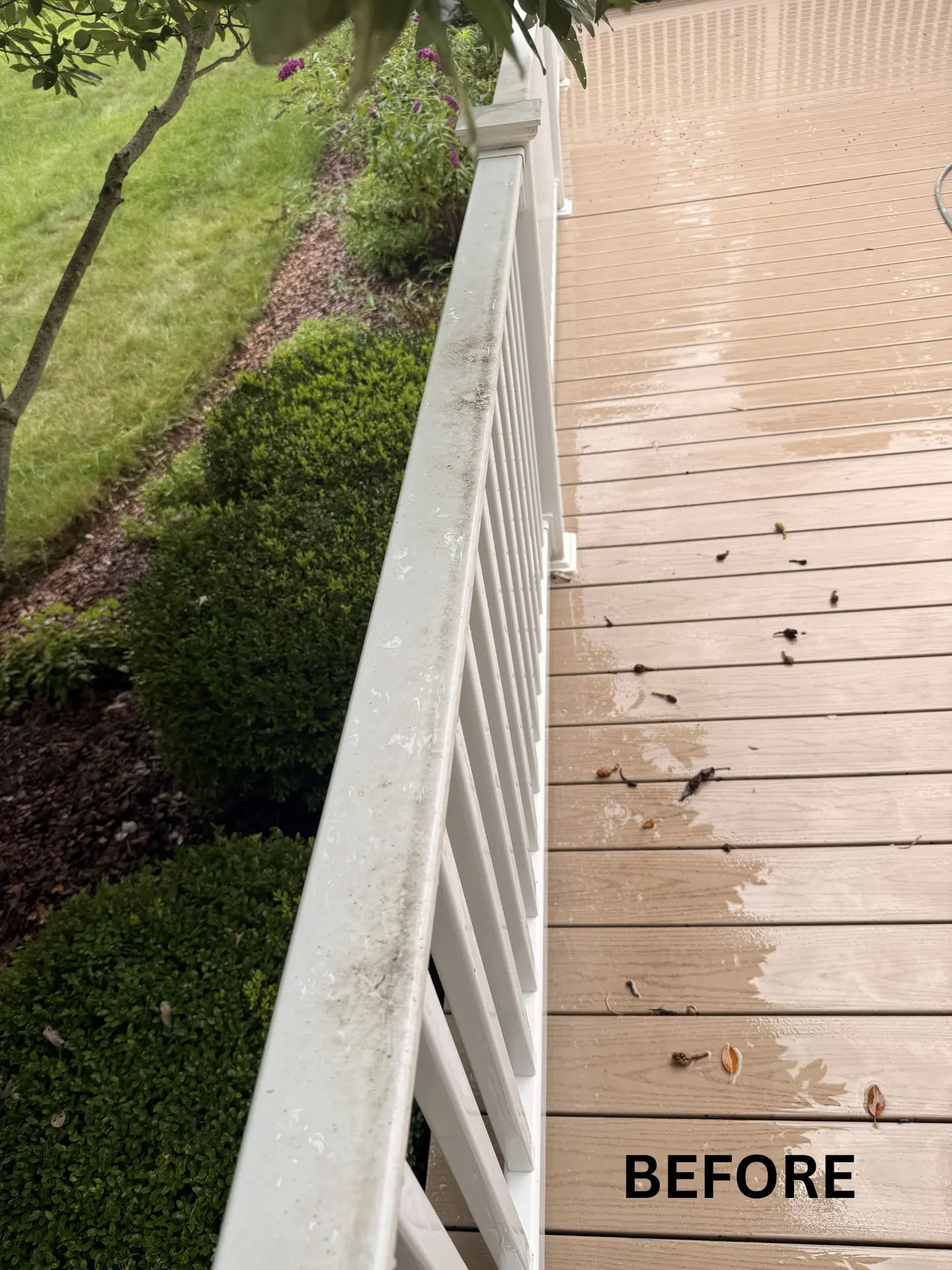 dirty handrail on porch before being pressure washed by power clean