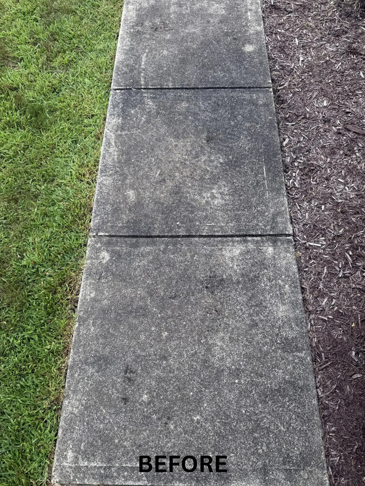 dirty Concrete sidewalk in Lancaster before being pressure washed by power clean