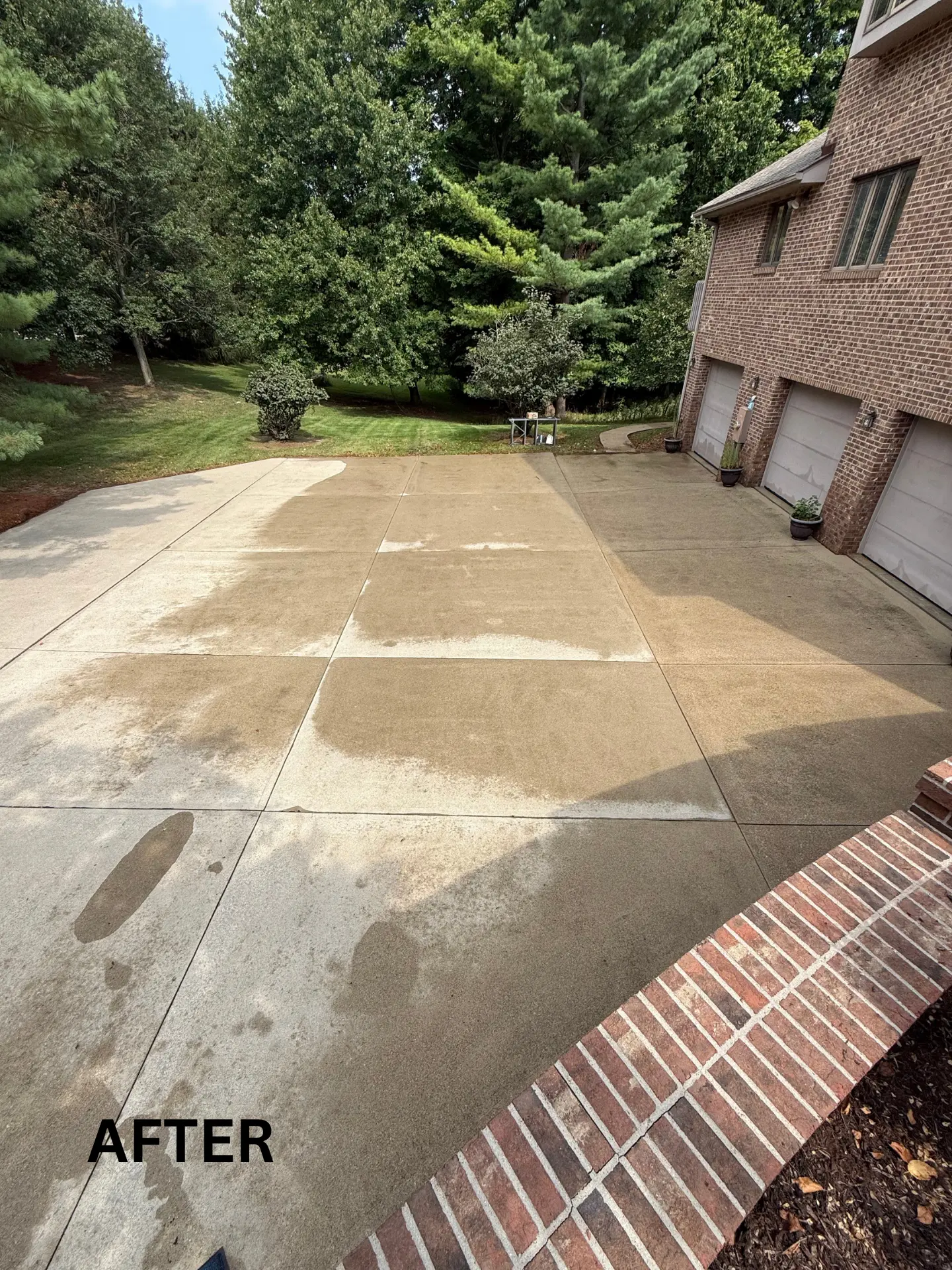 Residential concrete driveway in lancaster before being pressure washed