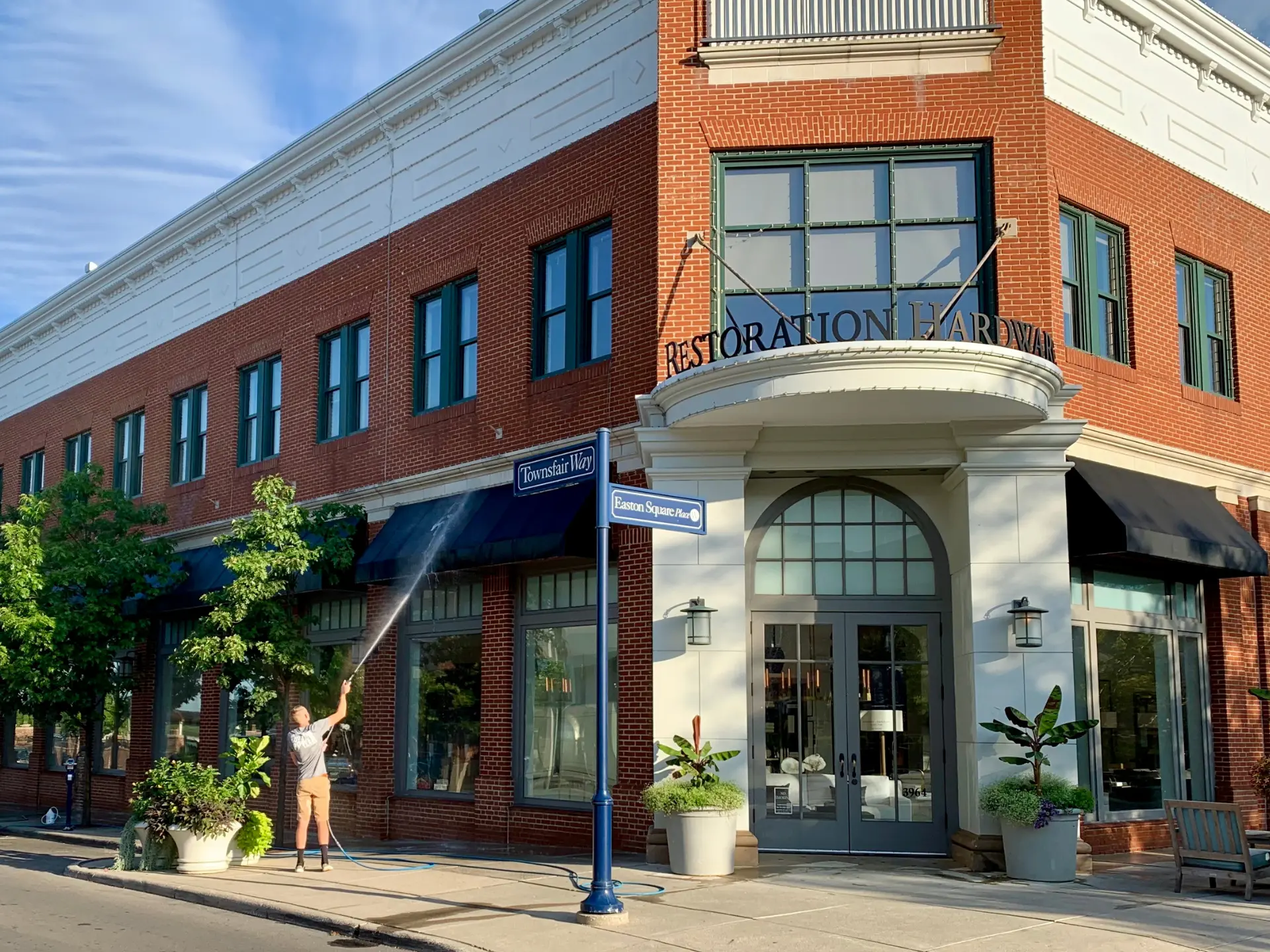 restoration-hardware-easton-pressure-washing Power clean technician pressure washing the exterior of restoration hardware at Easton oh